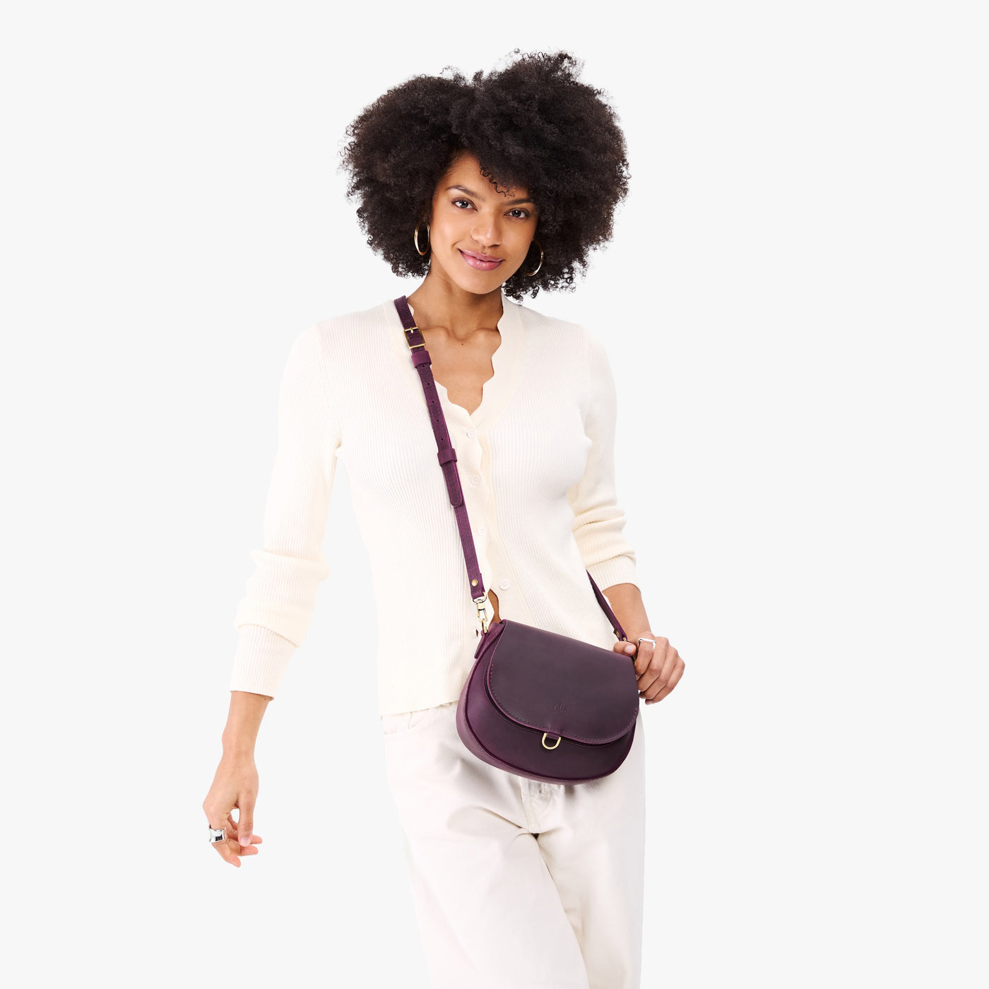 Larkspur*Small | Model wearing a petite leather Crossbody with a flap and magnetic closure