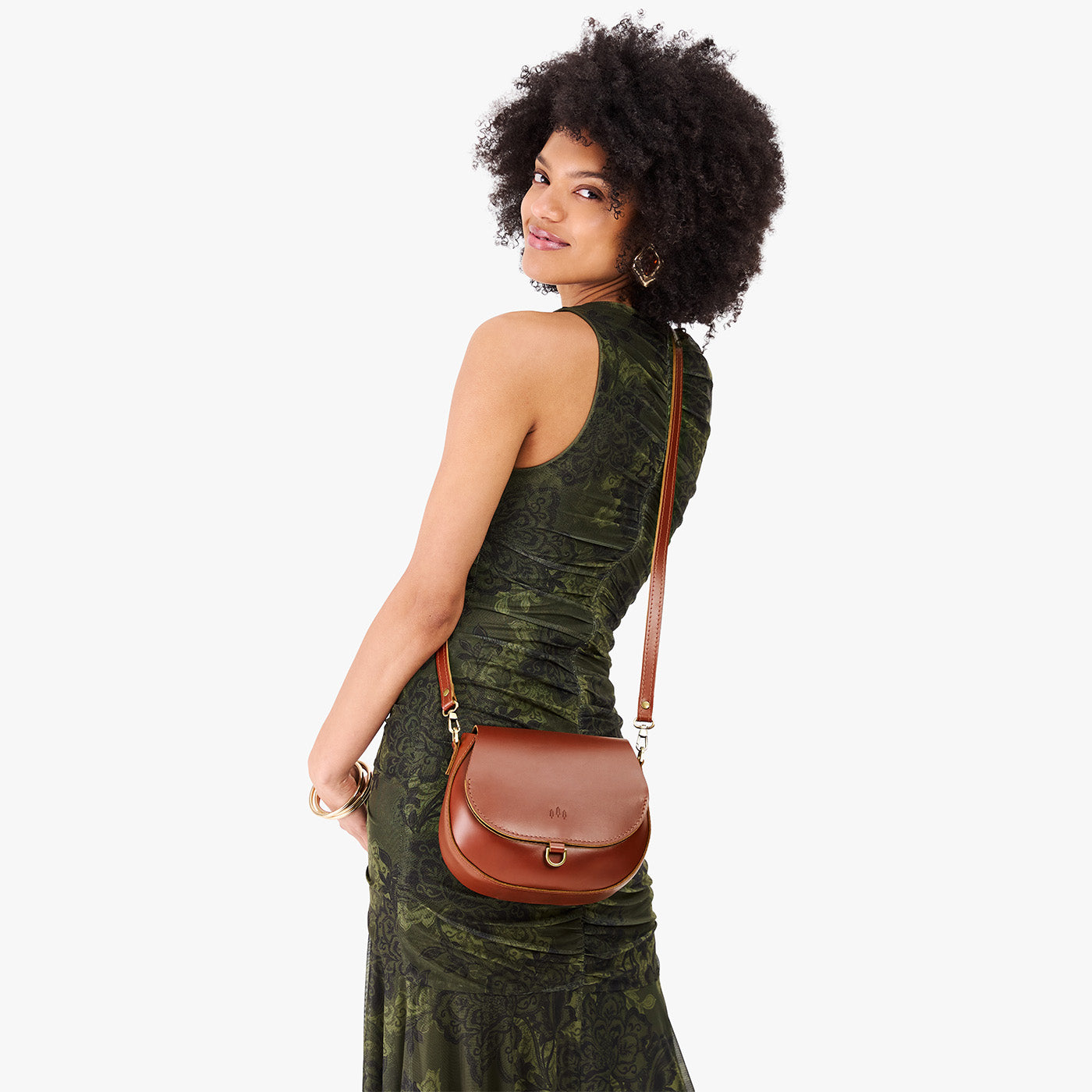 Madrone*Small | Model wearing a petite leather Crossbody with a flap and magnetic closure