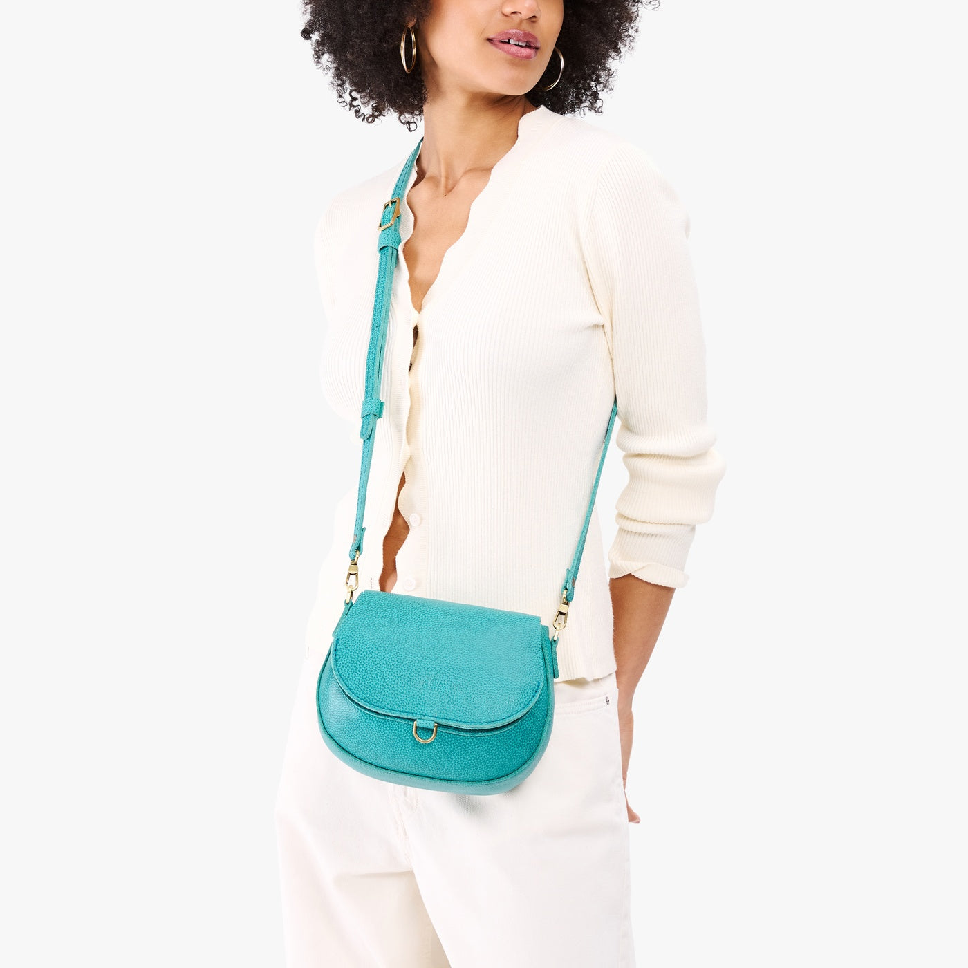Seafoam*Small | Model wearing a petite leather Crossbody with a flap and magnetic closure