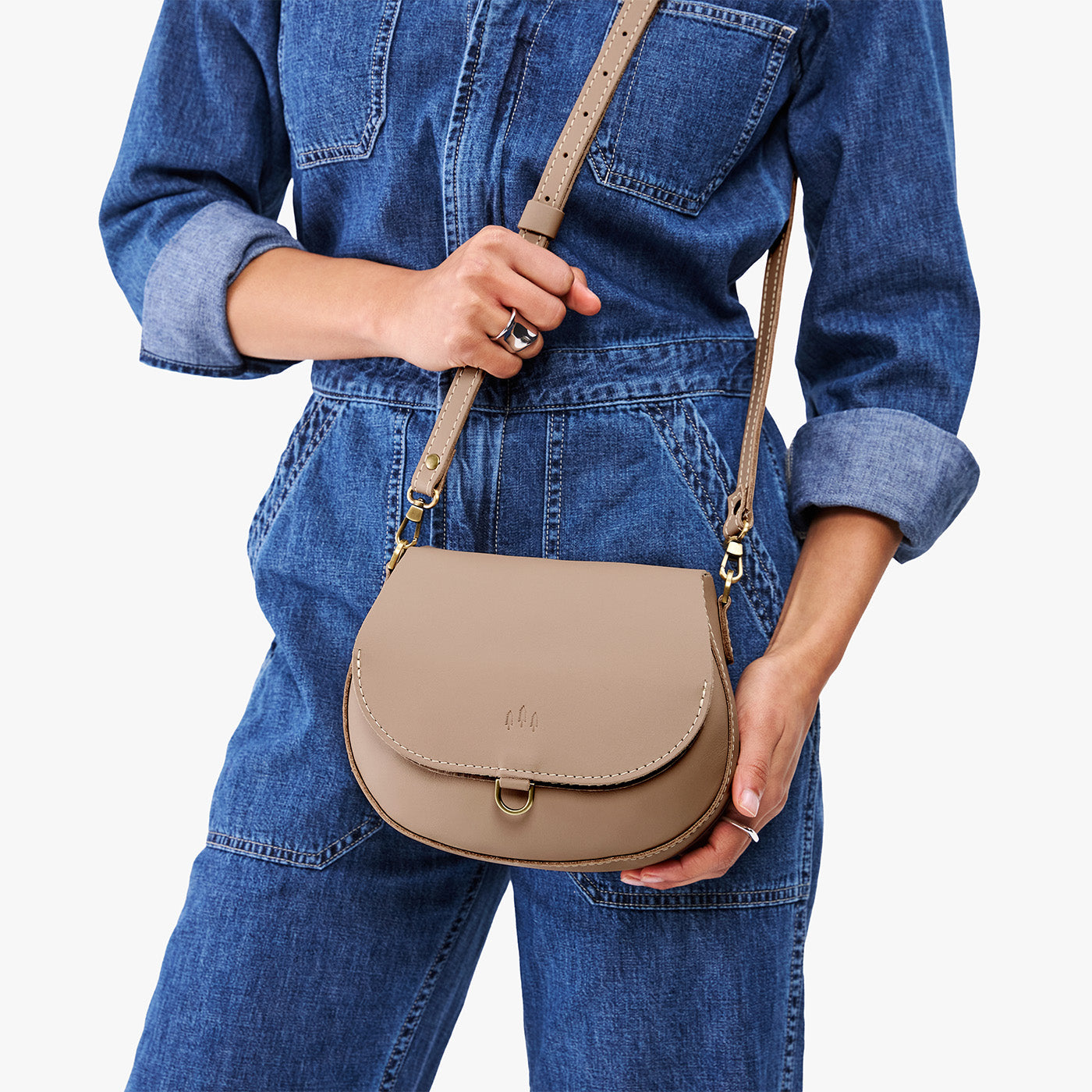 Stone*Small | Model wearing a petite leather Crossbody with a flap and magnetic closure