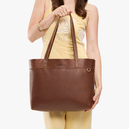 Asheville*Large*Classic | Model wearing leather tote bag with riveted straps and exterior key loop