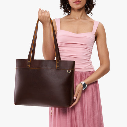 Coldbrew*Large*Classic | Model wearing leather tote bag with riveted straps and exterior key loop