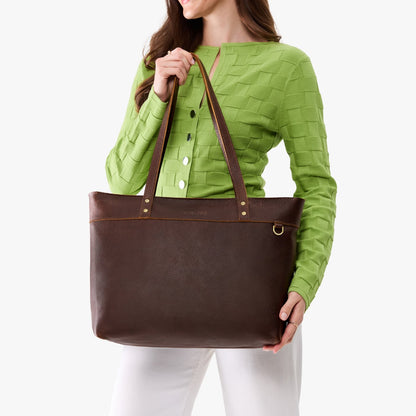Coldbrew*Large*Zipper | Model wearing leather tote bag with riveted straps and exterior key loop