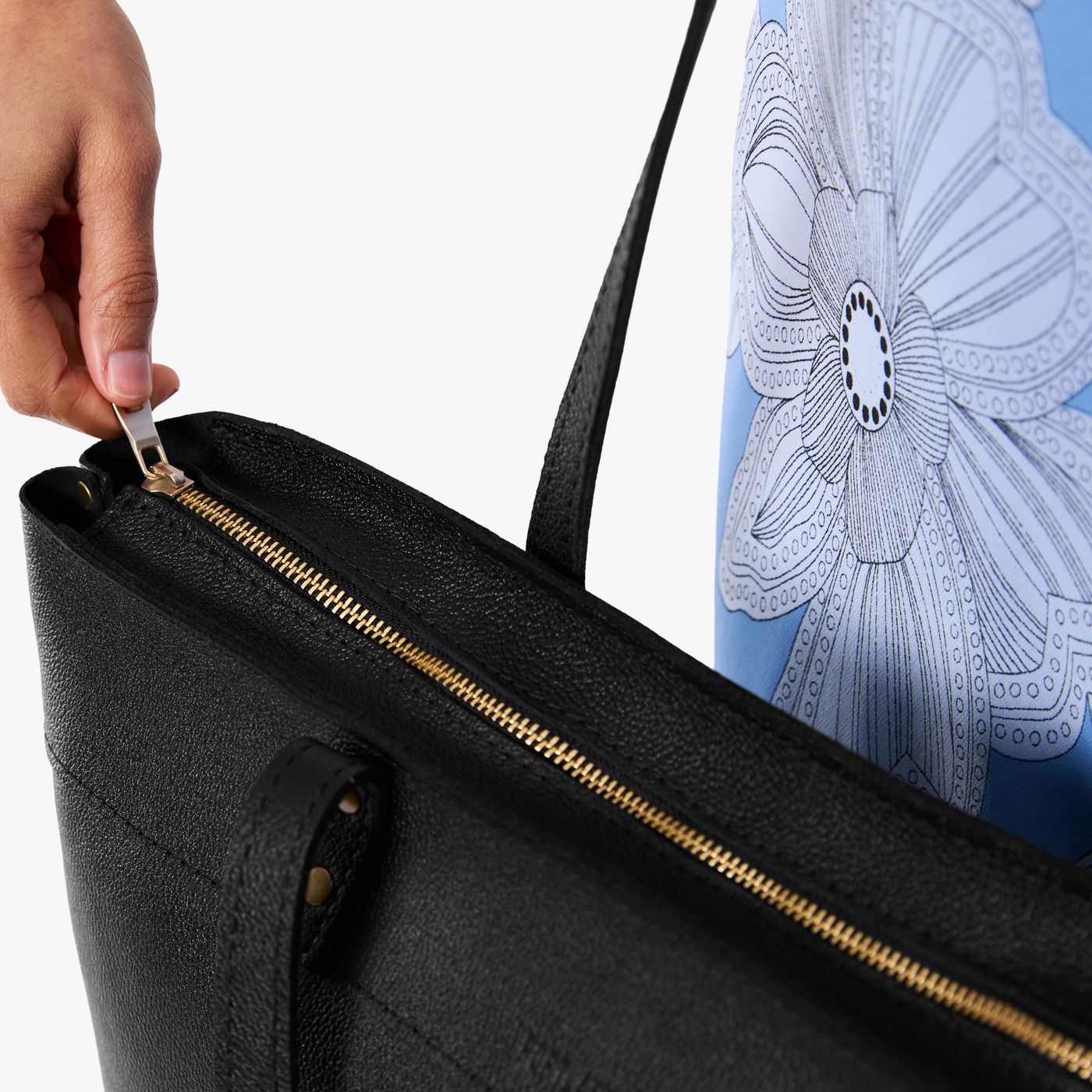 Pebbled--black*Large*Zipper | Model wearing leather tote bag with riveted straps and exterior key loop