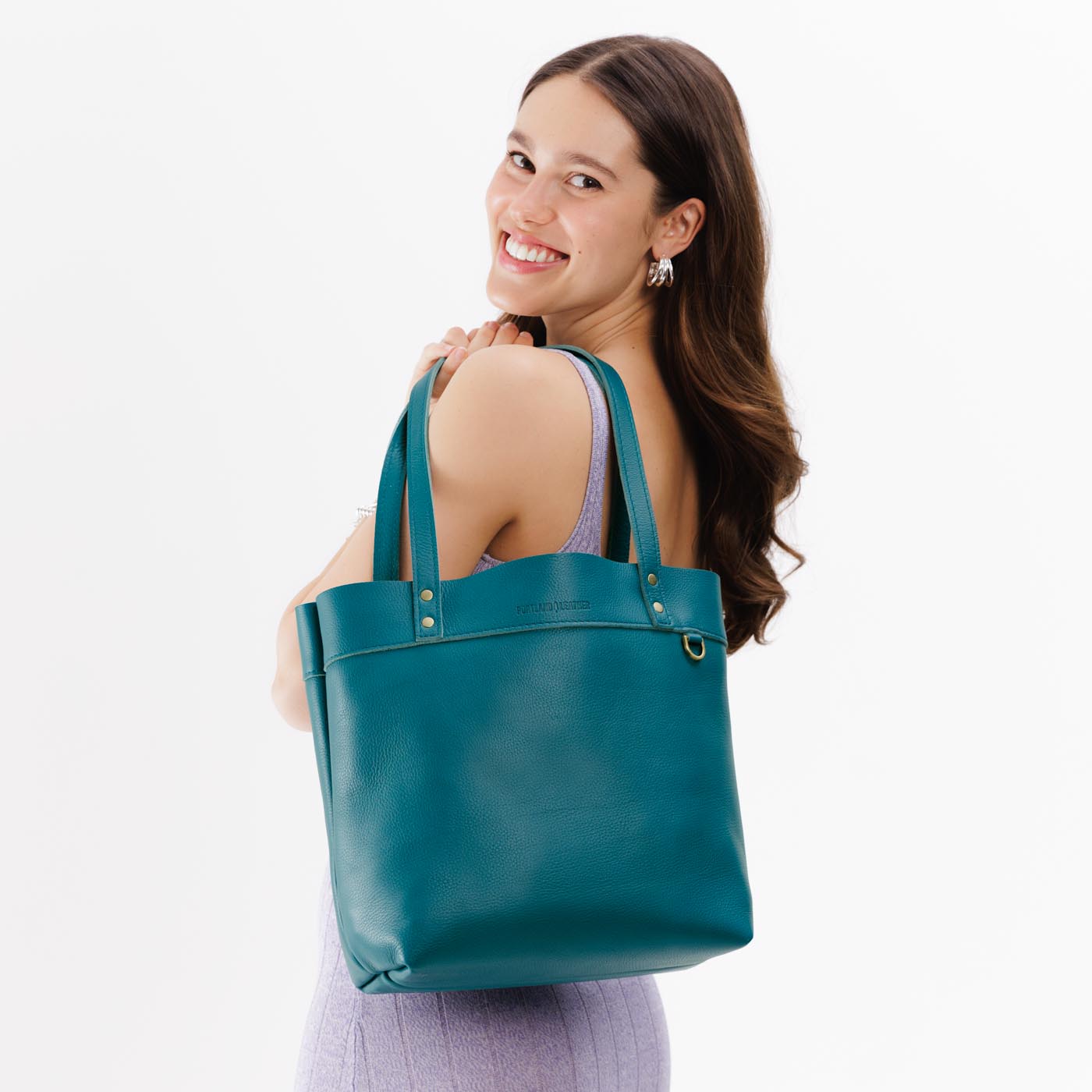 Soul Blue*Medium*Classic | Model wearing leather tote bag with riveted straps and exterior key loop