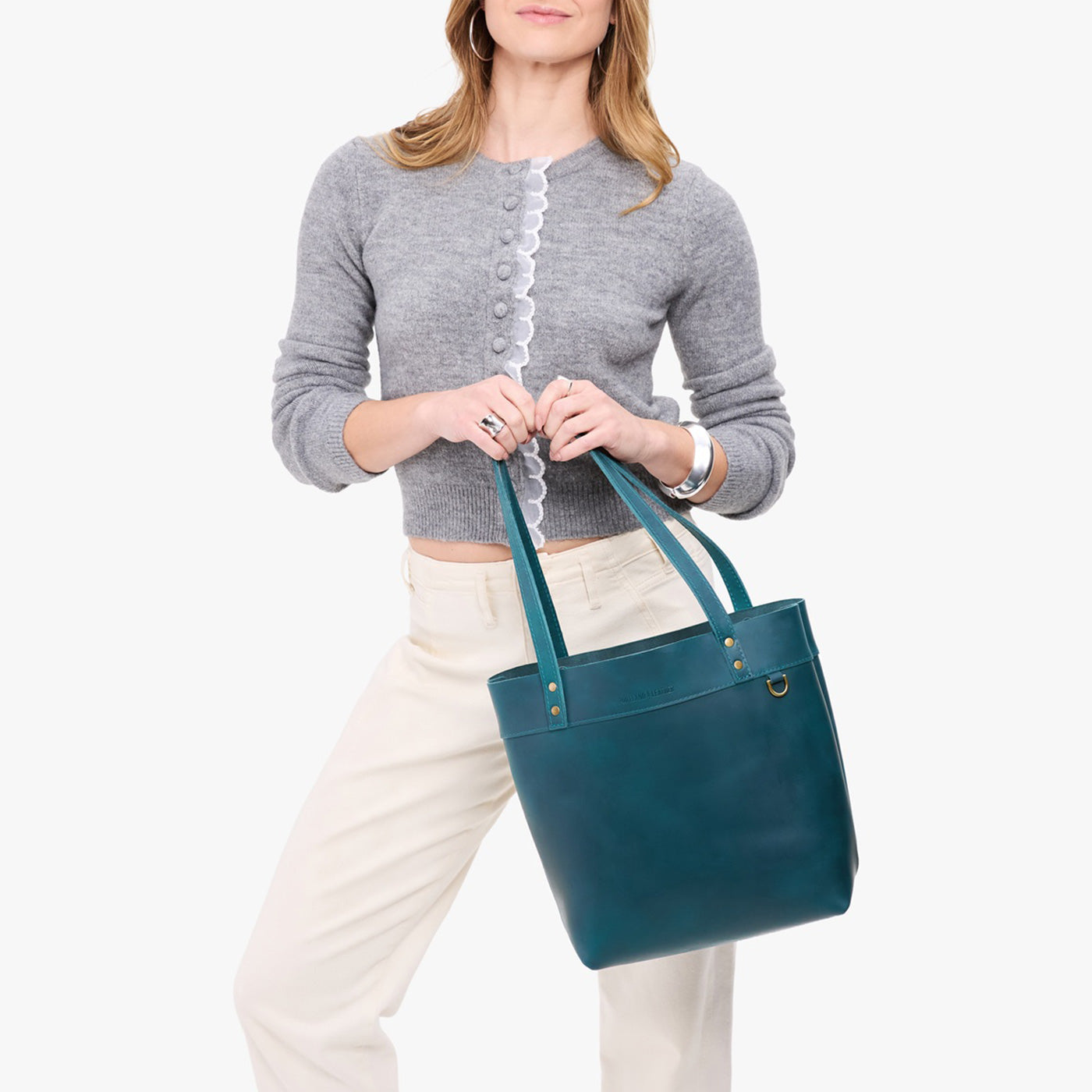 Westward Blue*Medium*Classic | Model wearing leather tote bag with riveted straps and exterior key loop