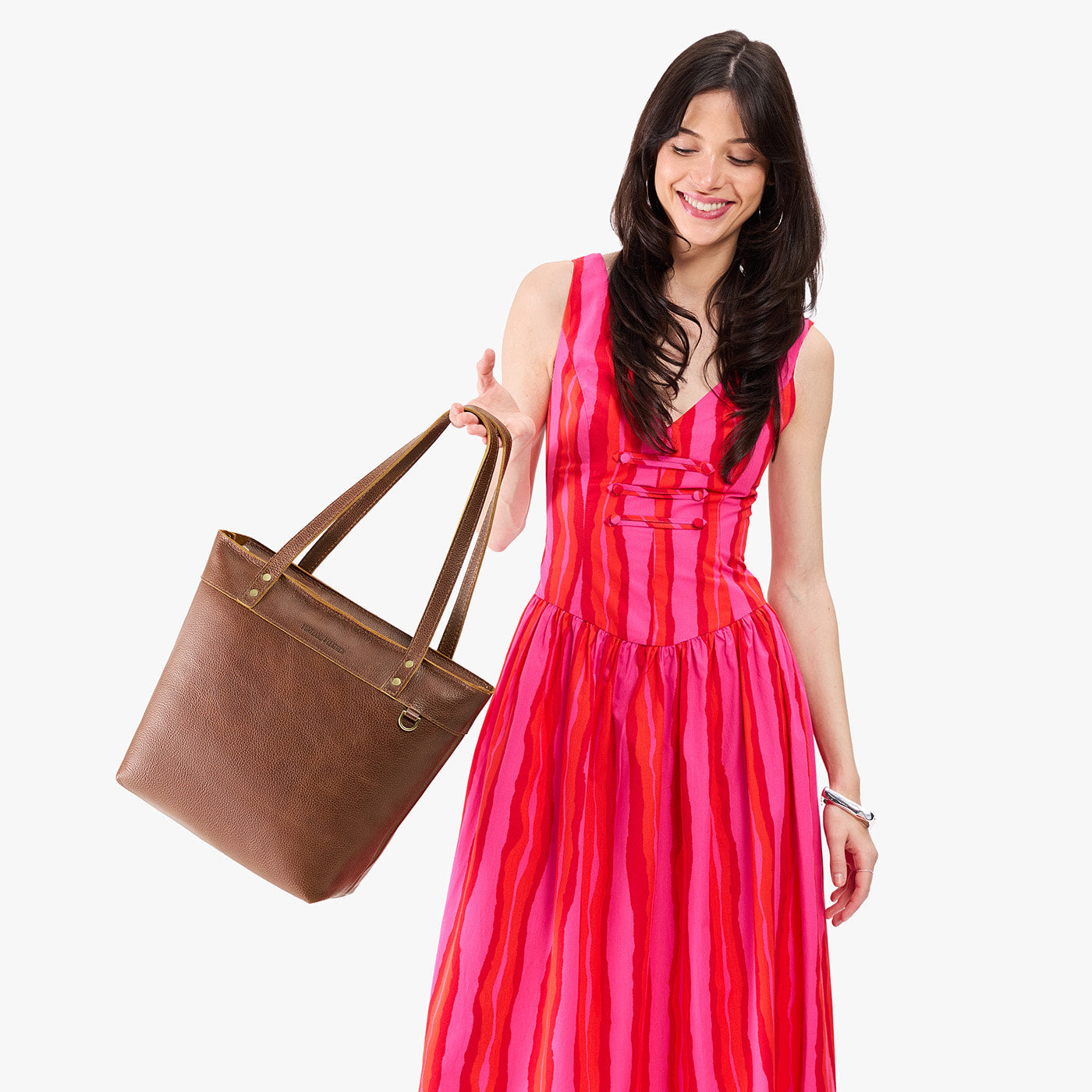 Asheville*Medium*Zipper | Model wearing leather tote bag with riveted straps and exterior key loop