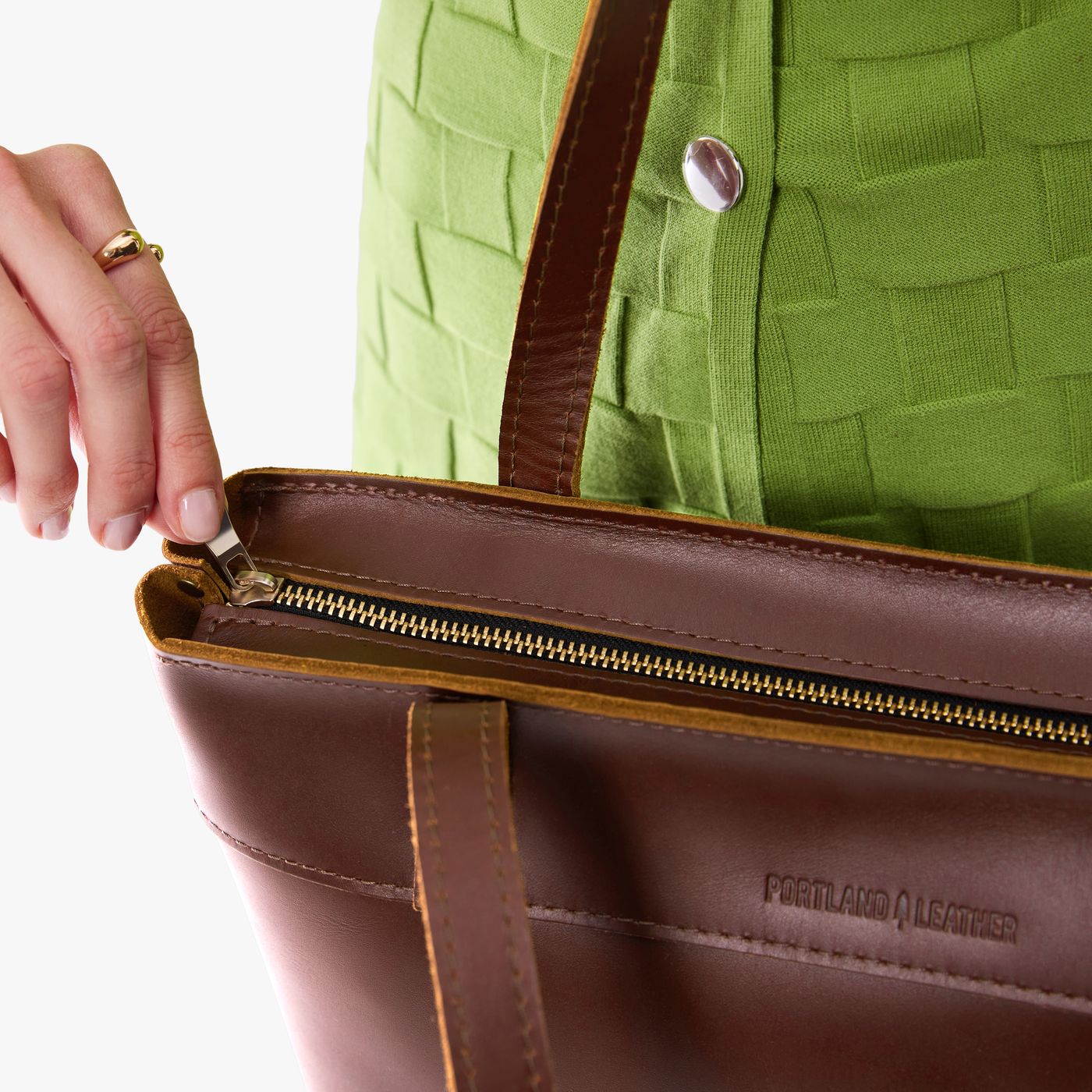 Cognac*Medium*Zipper | Model wearing leather tote bag with riveted straps and exterior key loop