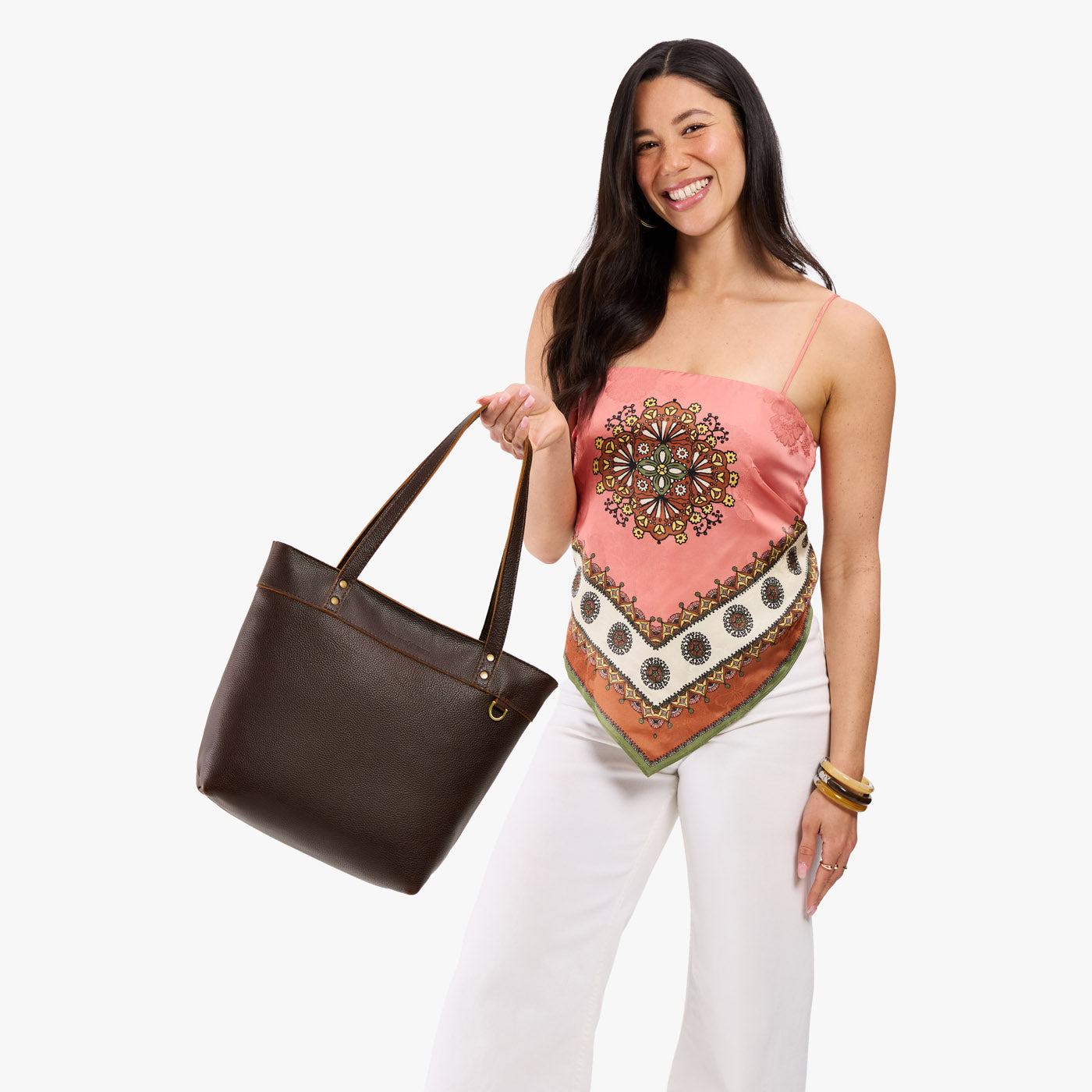 Coldbrew*Medium*Zipper | Model wearing leather tote bag with riveted straps and exterior key loop