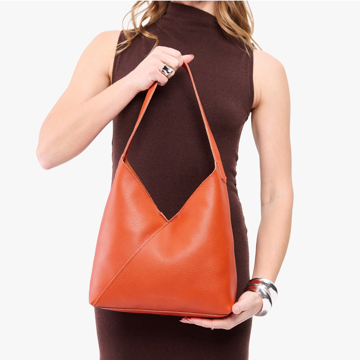 Koi*Large | Model wearing mid-size shoulder bag with magnetic snap