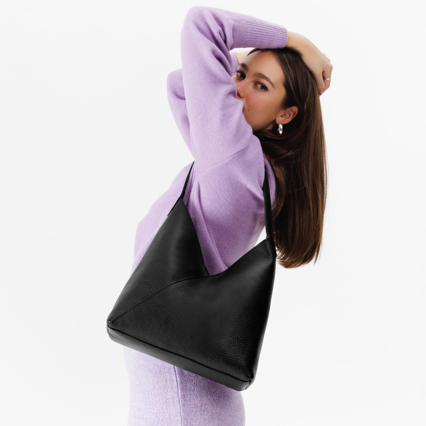 Pebbled--black*Large | Model wearing mid-size shoulder bag with magnetic snap
