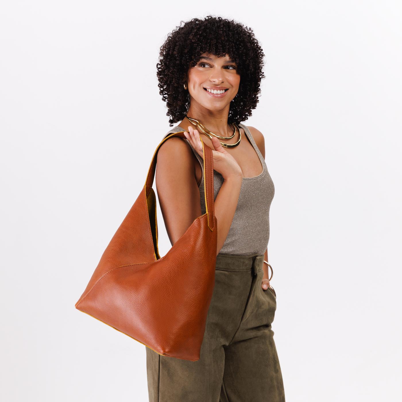 Sienna*Oversized | Model holding large shoulder bag with magnetic snap closure