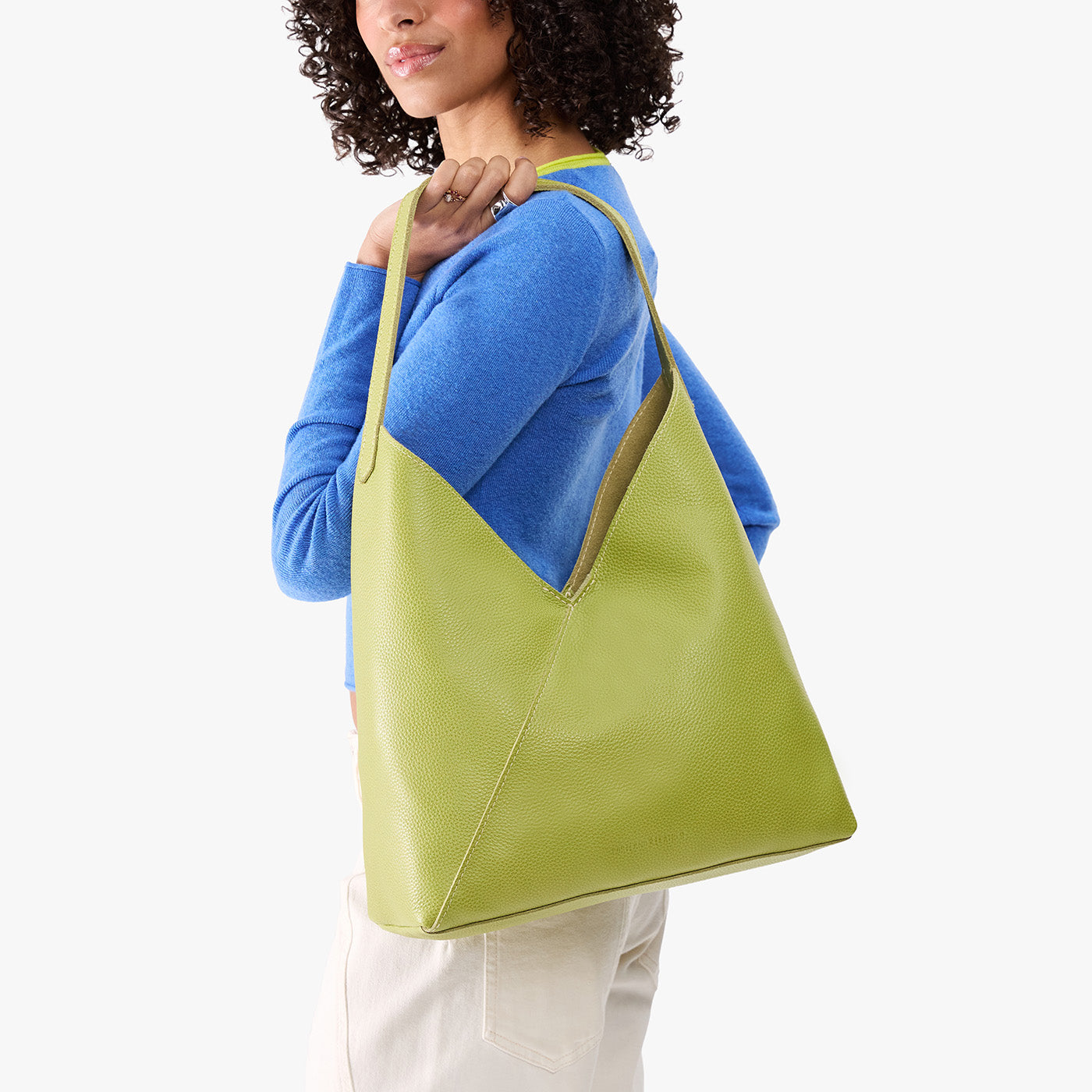 Wasabi*Oversized | Model wearing large shoulder bag with magnetic snap closure