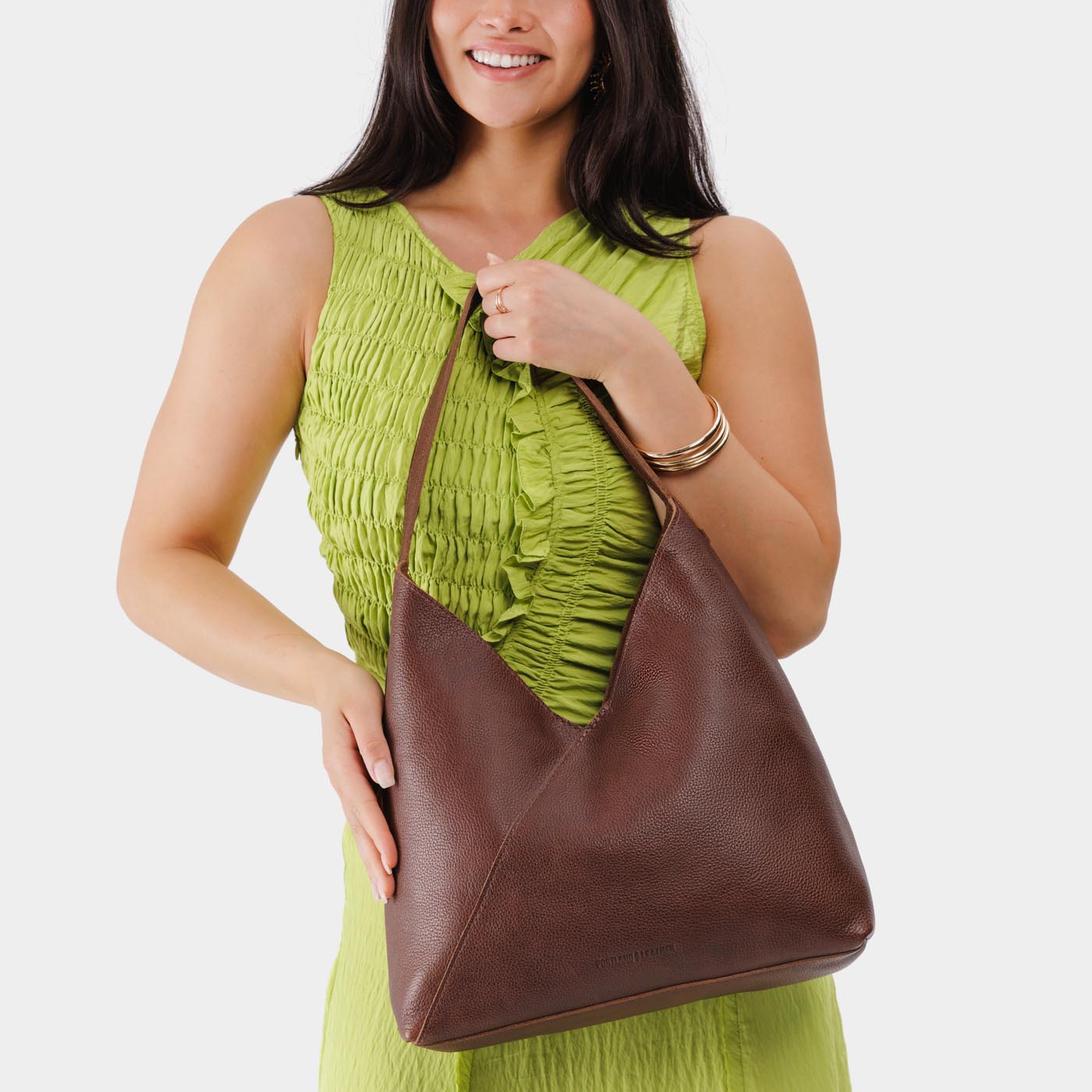 Durango*Oversized | Model wearing large shoulder bag with magnetic snap closure
