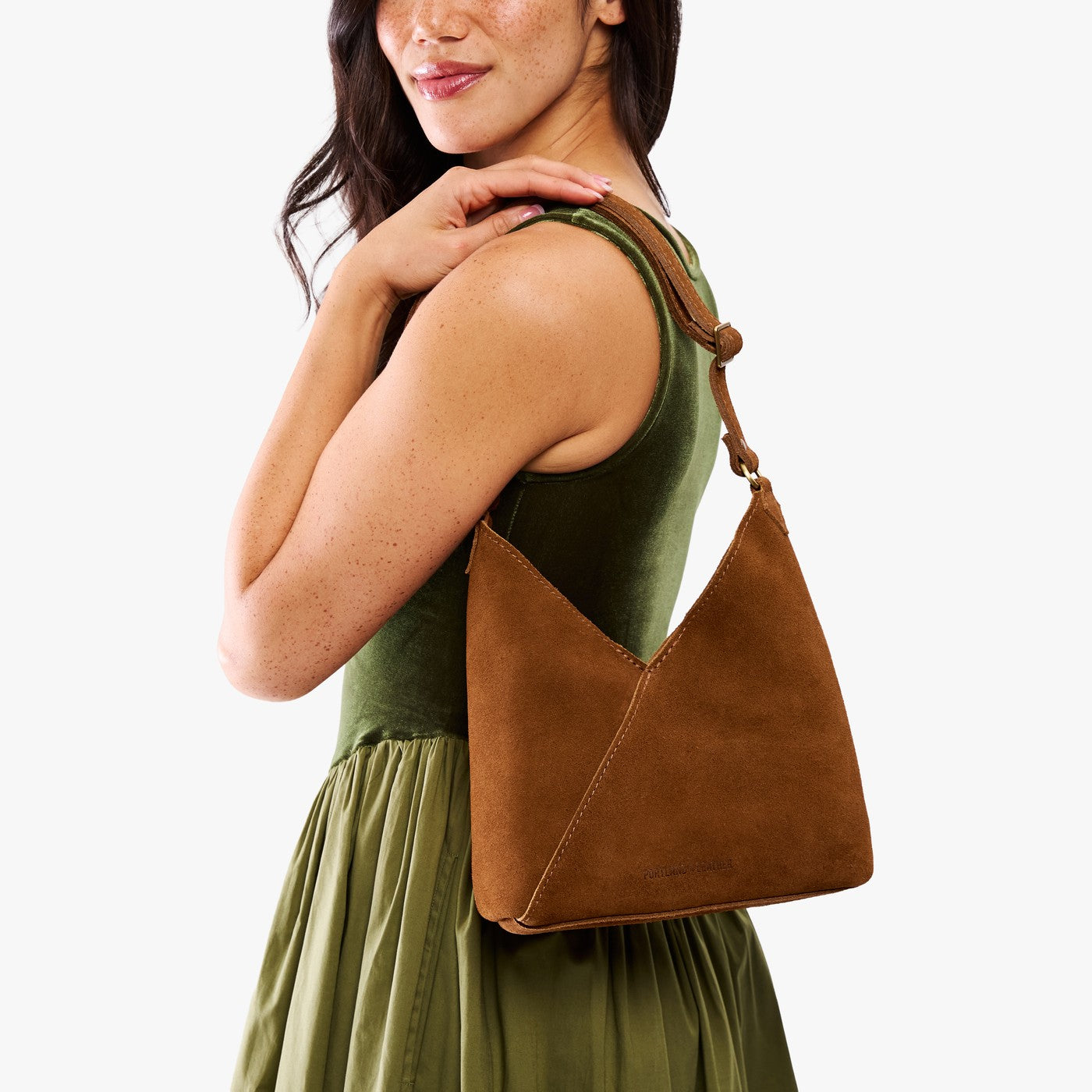 Jackson*Small | Model wearing petite shoulder bag with adjustable strap and magnetic snap closure