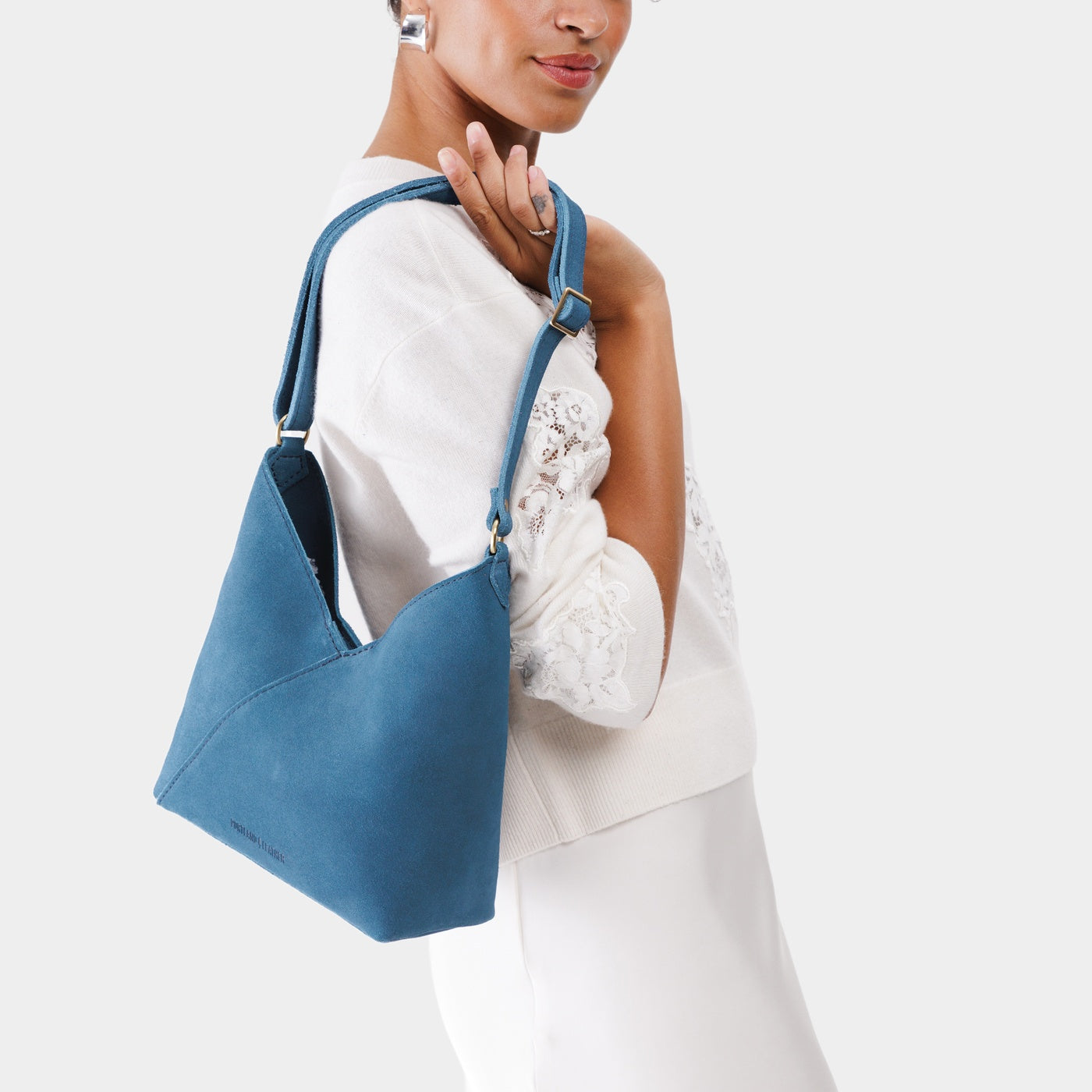 Mariner Blue*Small | Model wearing petite shoulder bag with adjustable strap and magnetic snap closure