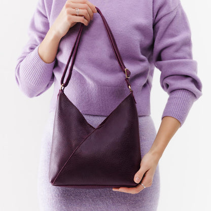 Plum*Small | Model wearing petite shoulder bag with adjustable strap and magnetic snap closure