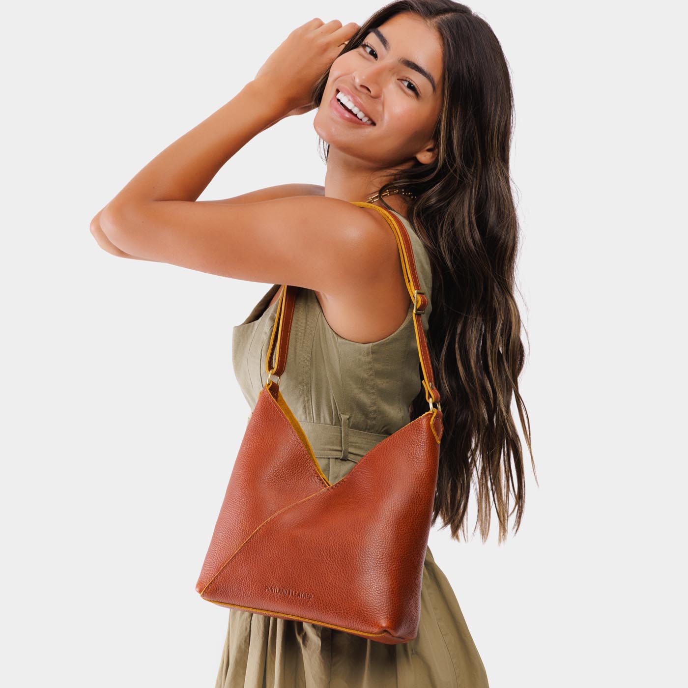 Sienna*Small | Model wearing petite shoulder bag with adjustable strap and magnetic snap closure