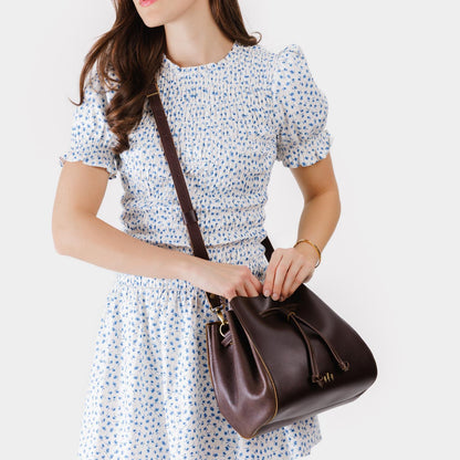 Grizzly | Model wearing bucket bag with cinched drawstring closure