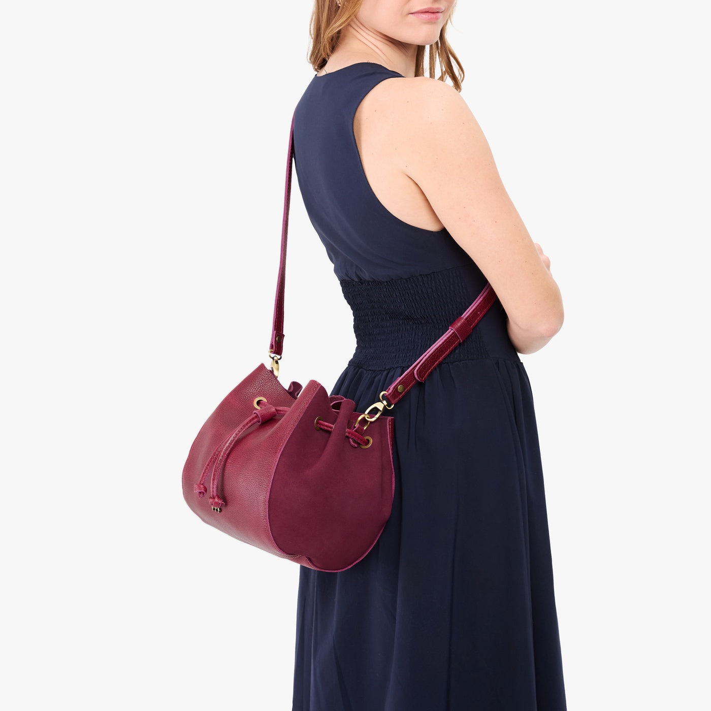 Orchid | Model wearing bucket bag with cinched drawstring closure