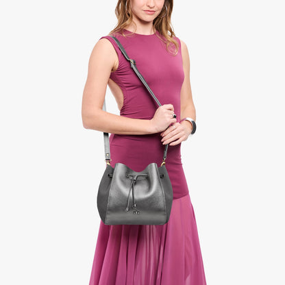 Stardust | Model wearing bucket bag with cinched drawstring closure