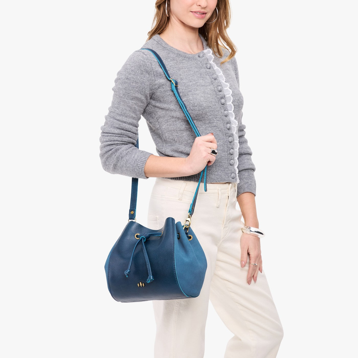 Caspian | Model wearing bucket bag with cinched drawstring closure