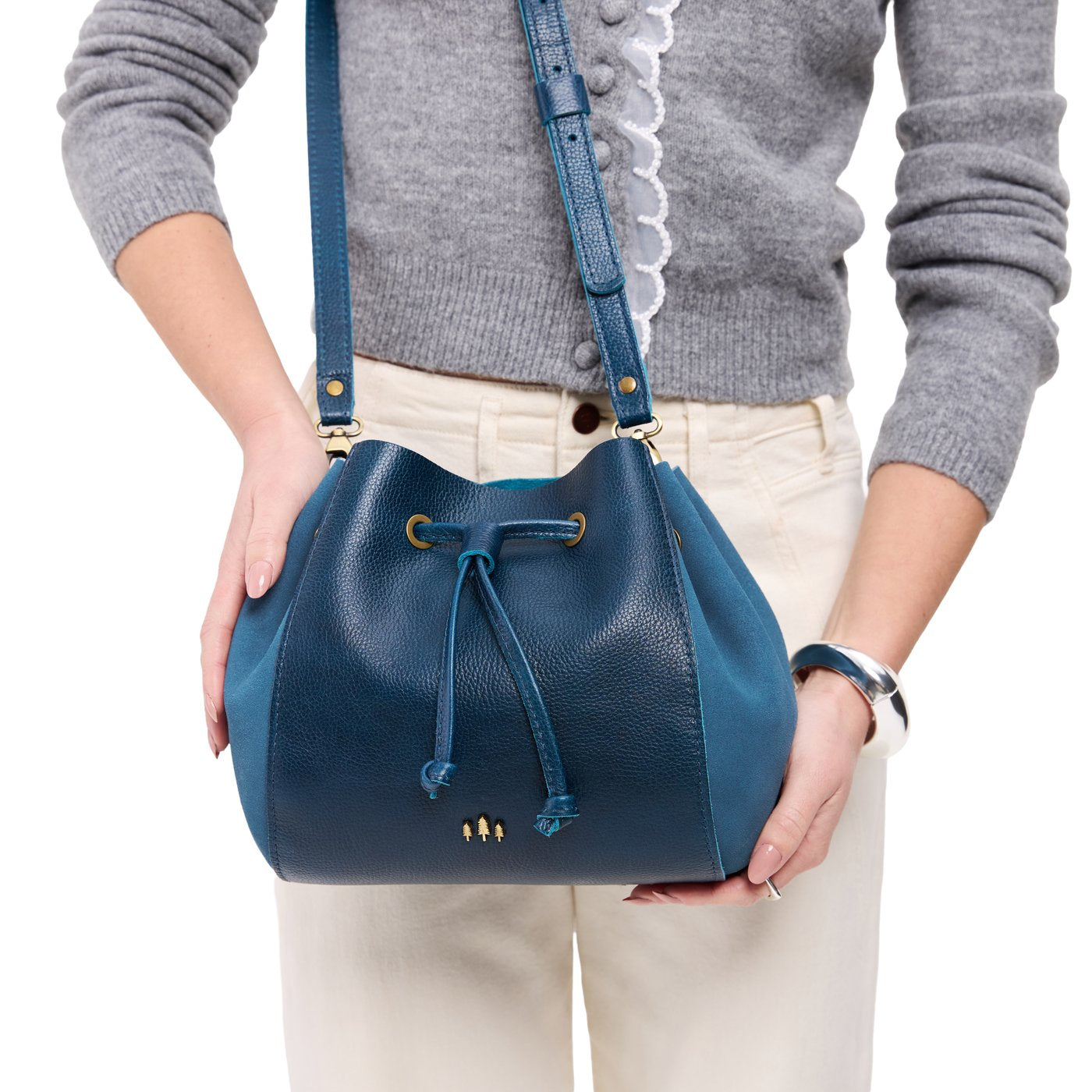 Caspian | Model wearing bucket bag with cinched drawstring closure