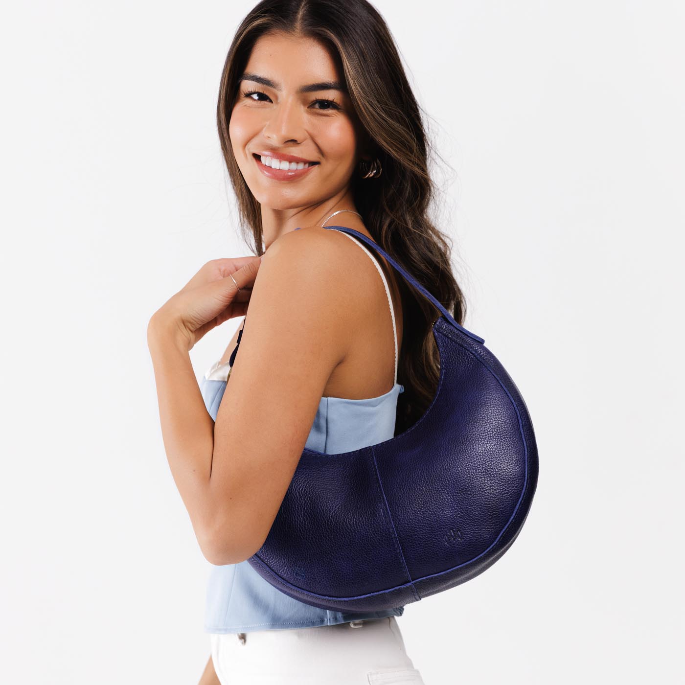 Cobalt*Small | Crescent shaped shoulder bag with zipper closure and adjustable strap