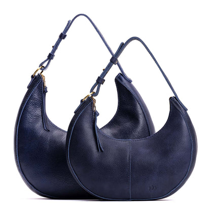 Cobalt | Crescent shaped shoulder bag with zipper closure and adjustable strap
