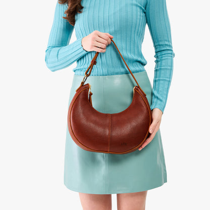 Nutmeg*Small | Crescent shaped shoulder bag with zipper closure and adjustable strap