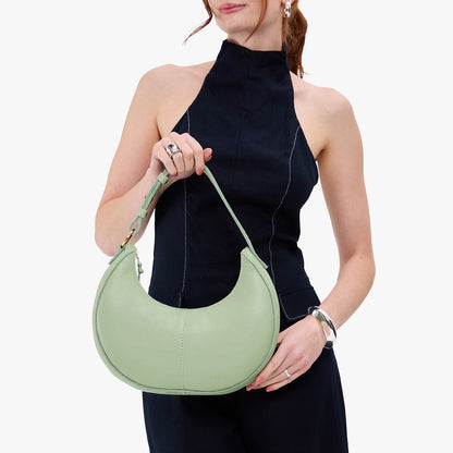 Pistachio*Small | Crescent shaped shoulder bag with zipper closure and adjustable strap