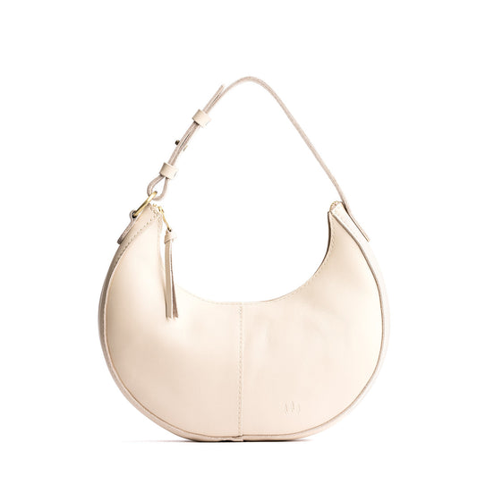 Bone*Small | Crescent shaped shoulder bag with zipper closure and adjustable strap