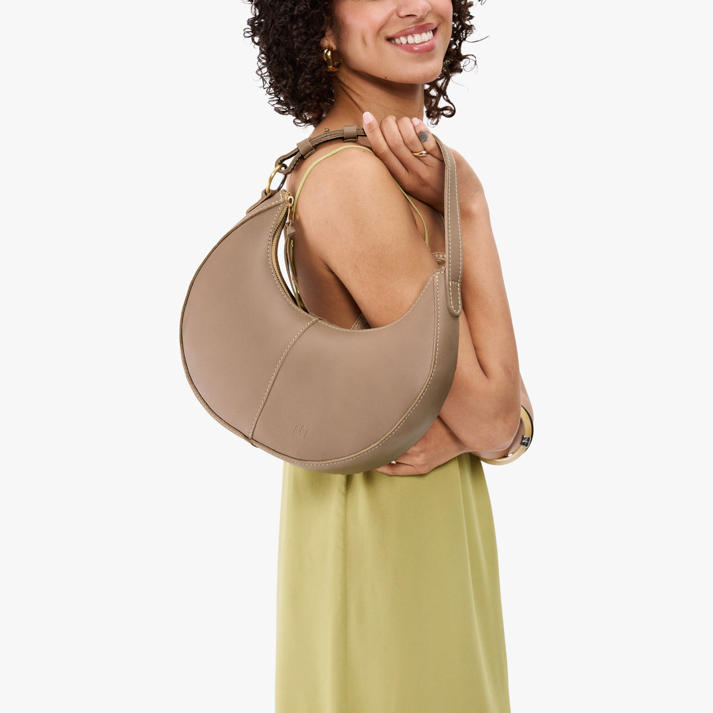Stone*Small | Crescent shaped shoulder bag with zipper closure and adjustable strap