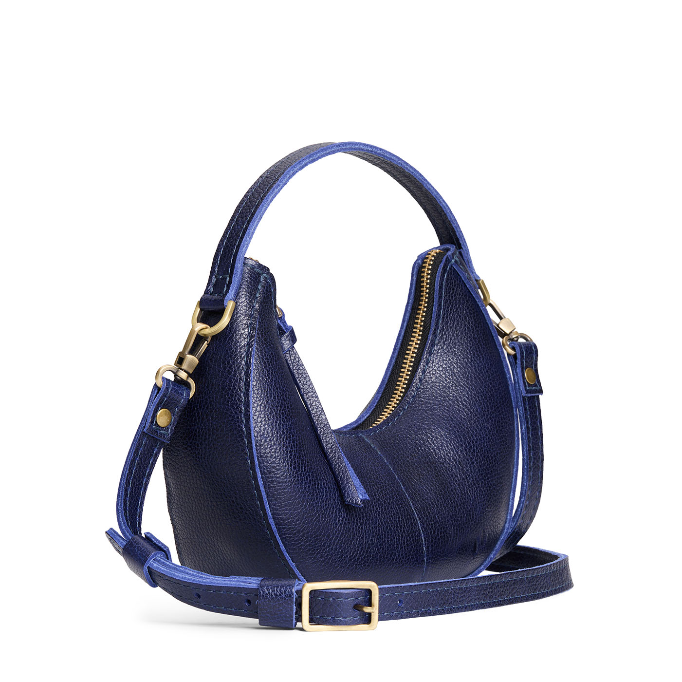 Cobalt | Crescent shaped shoulder bag with zipper closure and gold accents