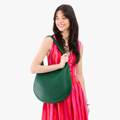 Bacalar*Large | Model holding round leather purse with adjustable shoulder strap