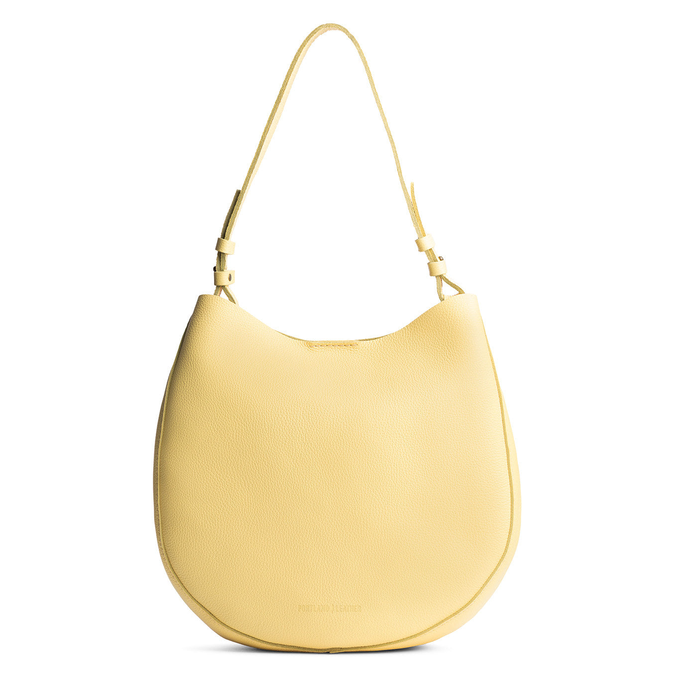 Butter Bliss*Large | Rounded shoulder bag with adjustable strap on a white background