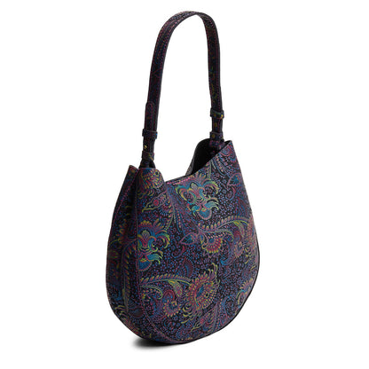 Carnival*Large | Model holding round leather purse with adjustable shoulder strap