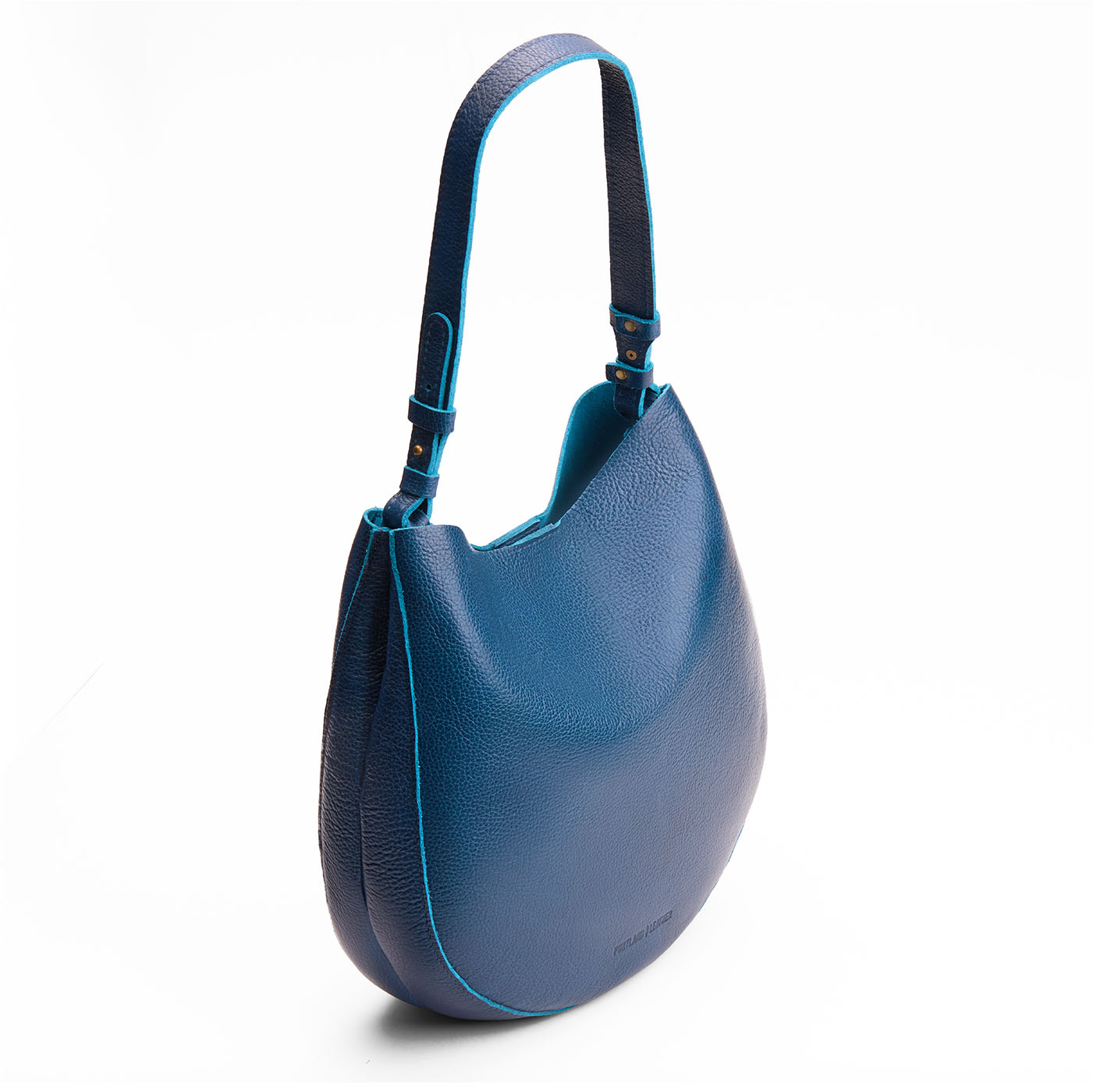 Caspian*Large | Rounded shoulder bag with adjustable strap on a white background