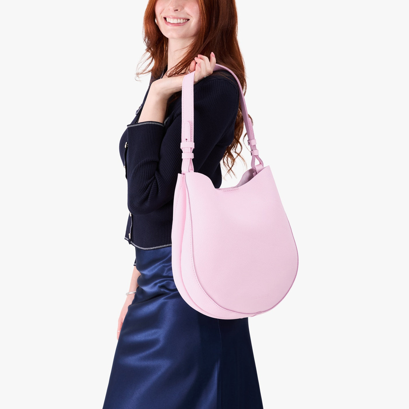 Pinkaboo*Large | Model holding round leather purse with adjustable shoulder strap