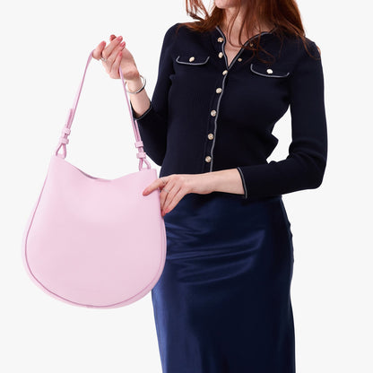 Pinkaboo*Large | Model holding round leather purse with adjustable shoulder strap