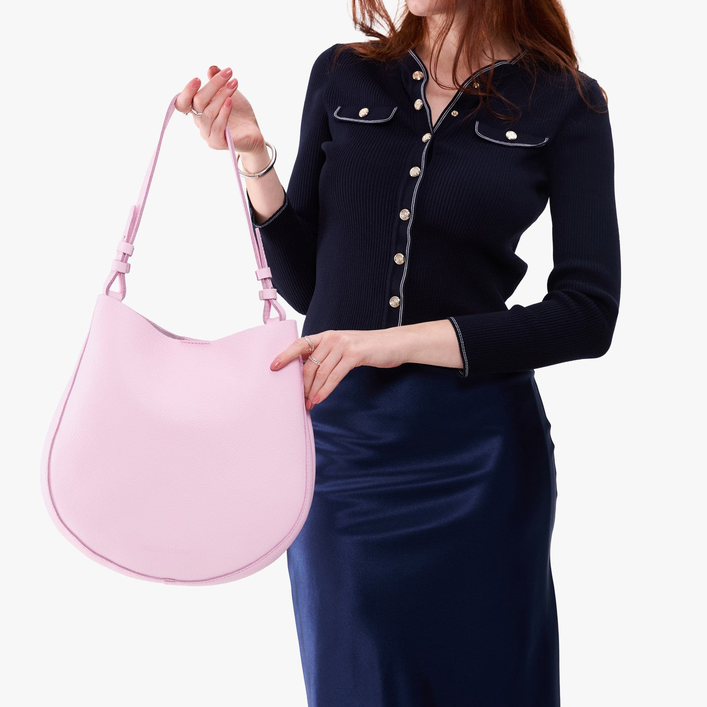 Pinkaboo*Large | Model holding round leather purse with adjustable shoulder strap