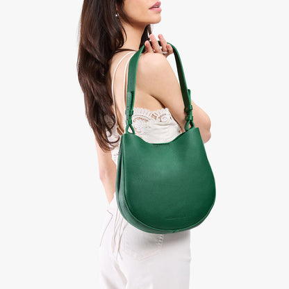 Bacalar*Medium | Model holding round leather purse with adjustable shoulder strap