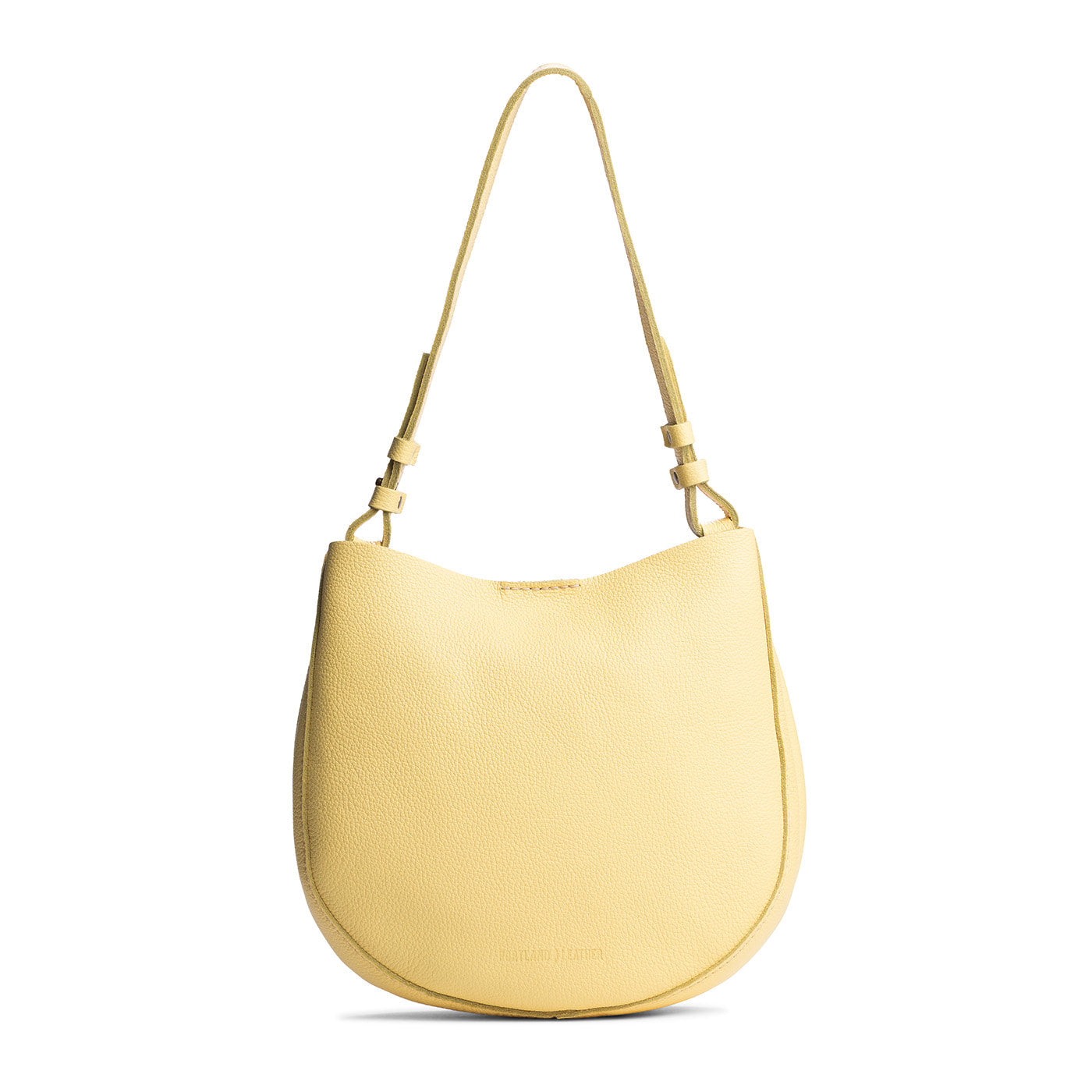 Butter Bliss*Medium | Rounded shoulder bag with adjustable strap on a white background