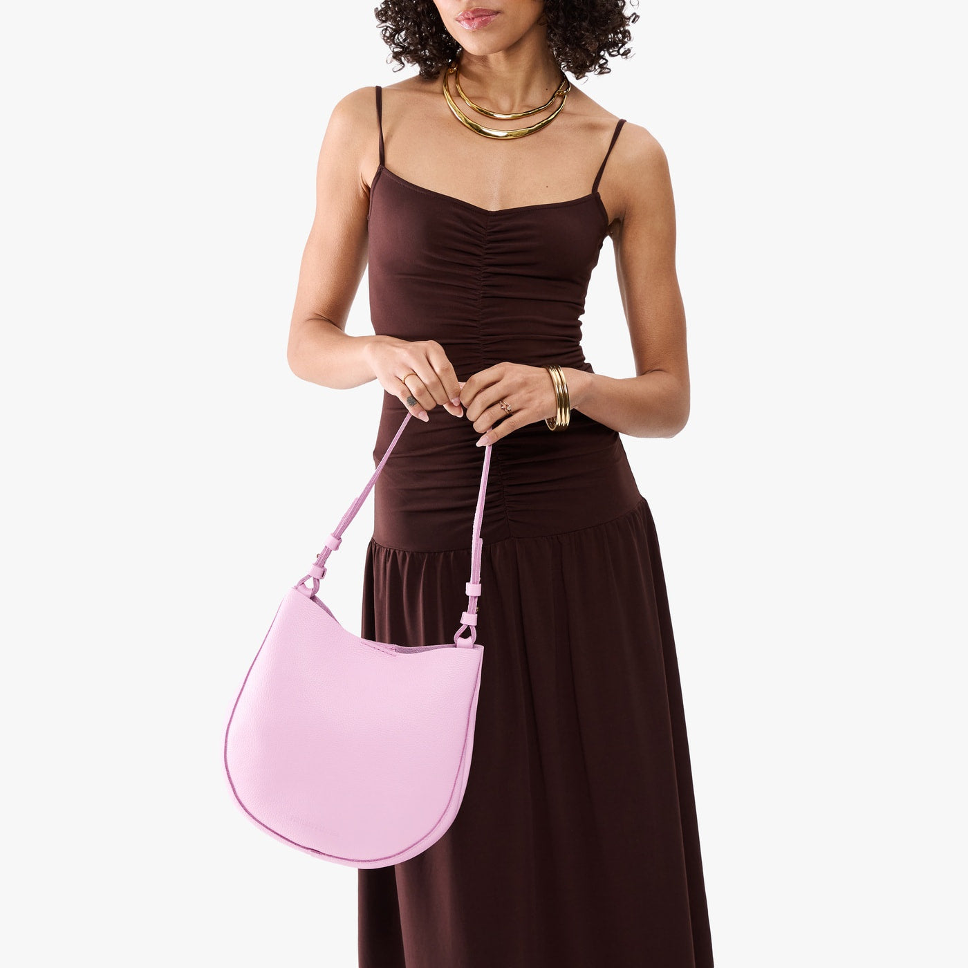 Pinkaboo*Medium | Model holding round leather purse with adjustable shoulder strap