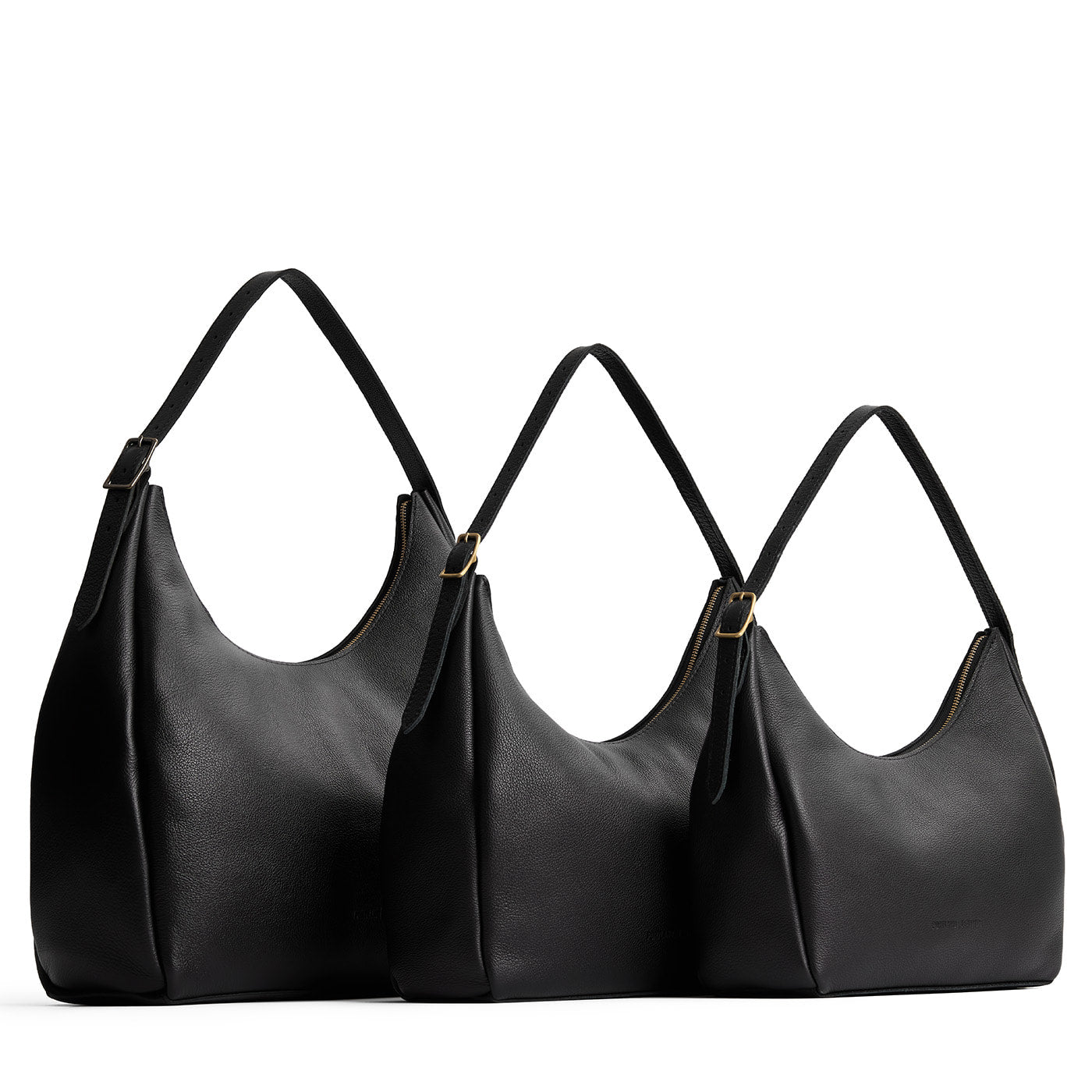 Pebbled--black | Size comparison image of oversized, large, and medium u-shaped, flat-bottomed leather shoulder bags with adjustable strap