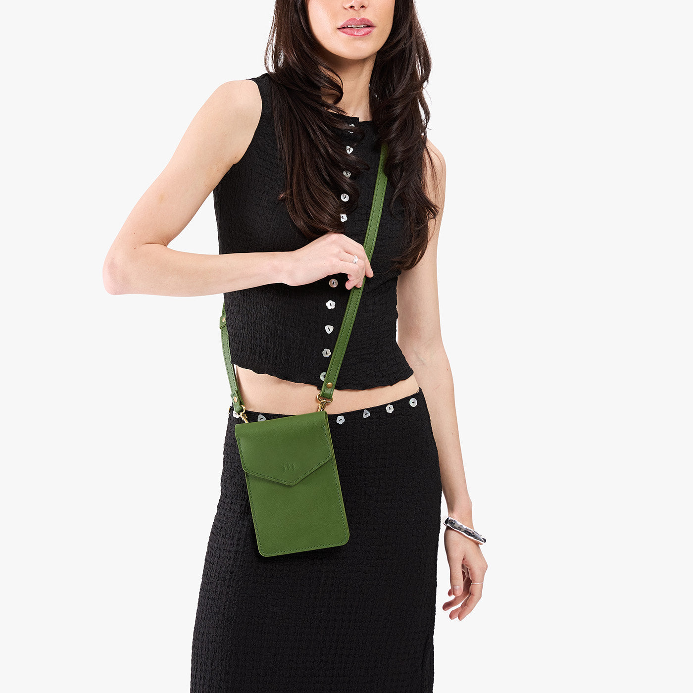Cactus | Model wearing slim, phone-shaped crossbody purse with magnetic closure