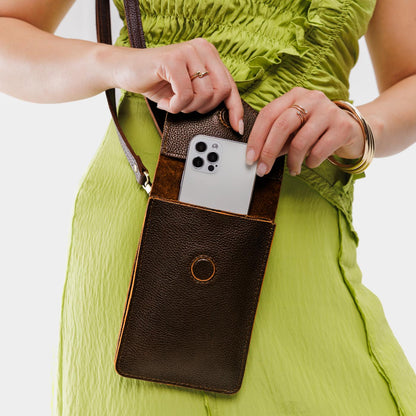 Coldbrew | Model wearing slim, phone-shaped crossbody purse with magnetic closure