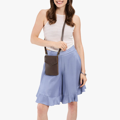 Grizzly | Model wearing slim, phone-shaped crossbody purse with magnetic closure