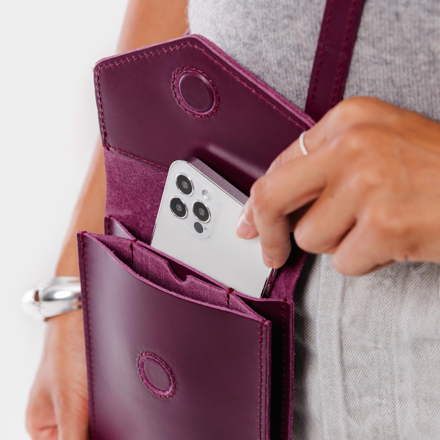 Lollipop | Model wearing slim, phone-shaped crossbody purse with magnetic closure