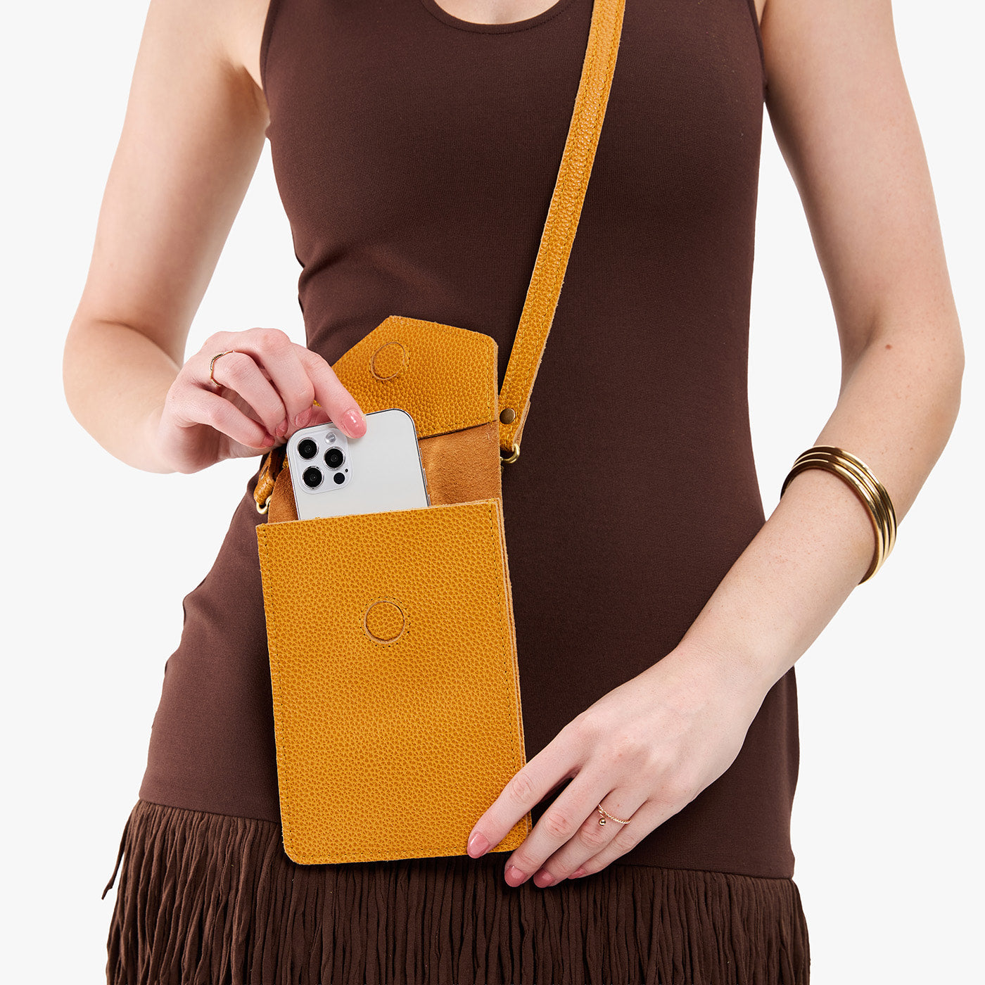 Sunshine | Model wearing slim, phone-shaped crossbody purse with magnetic closure
